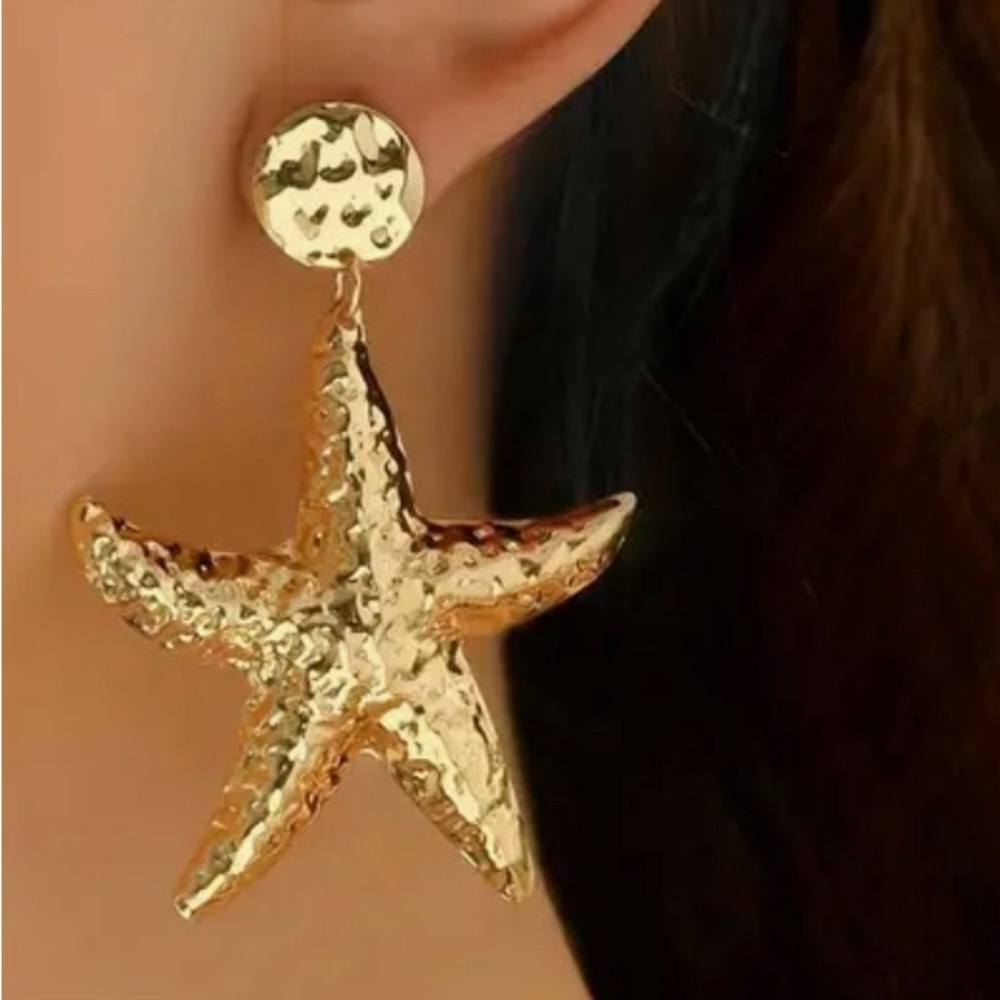 Gold tone metal drop starfish pierced earrings